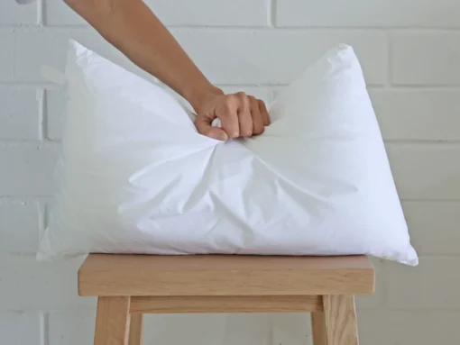 An insert is being pushed by an arm.