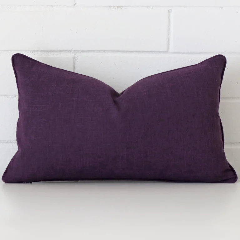 Front view of rectangle cushion. Crafted from a special linen material in a plum colour.