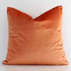 Vibrant solid coloured velvet cushion cover in a stylish square size with orange colouring.